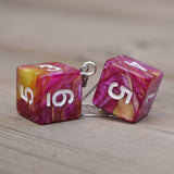 Rasberry Mango Swirl swirl RPG dice earrings