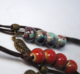 Set of 5 glazed ceramic bracelets with leaf charm