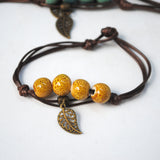 Set of 5 glazed ceramic bracelets with leaf charm