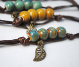 Set of 5 glazed ceramic bracelets with leaf charm