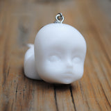 Creepy baby heads earrings