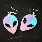 Glittery alien face earrings