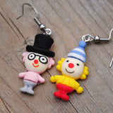 Weird little circus guys with fancy hats earrings