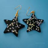 Large stars within stars earrings