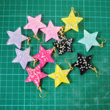 Large stars within stars earrings