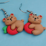 Clingy but cute strawberry bear earrings