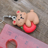 Clingy but cute strawberry bear earrings