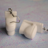 Stinky gross toilet earrings for weirdos